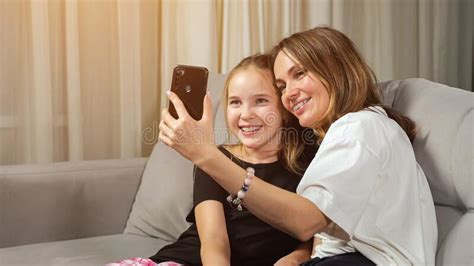 Mother And Teen Daughter Make Selfie In Living Room At Home Stock Image Image Of Smiling