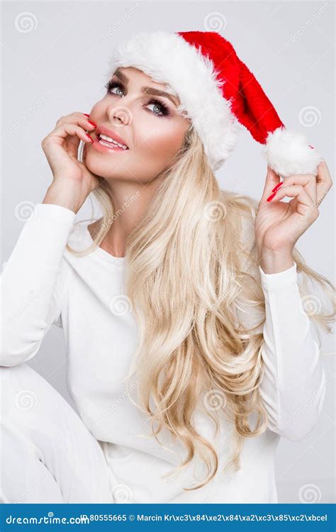 Beautiful Blonde Female Model Dressed As Santa Claus In A Red Cap Stock Image Image Of Female