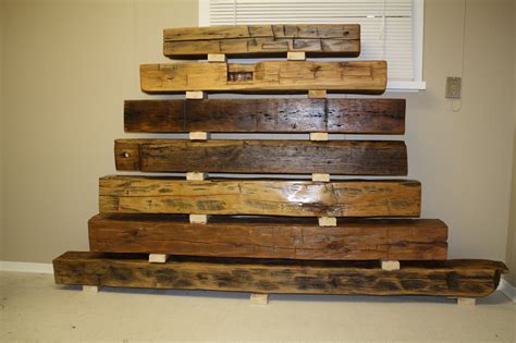 We specialize in using this reclaimed wood to create feature walls, mantels, accents, barn wood doors and feature ceilings. Barn Beams: Fireplace Mantels