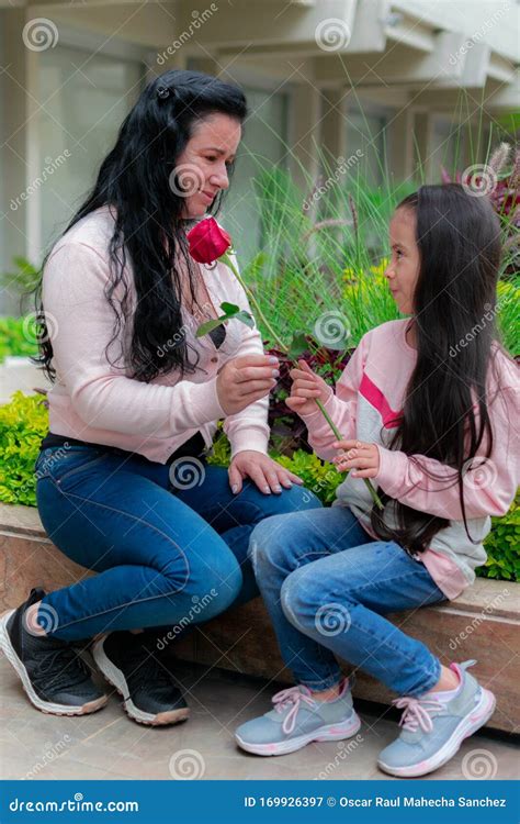 colombian latin american girl gives her mother a rose on mother`s day stock image image of
