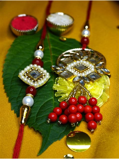 Lustrous Bhaiya Bhabhi Rakhi Made With Pearl And Kundan Buy