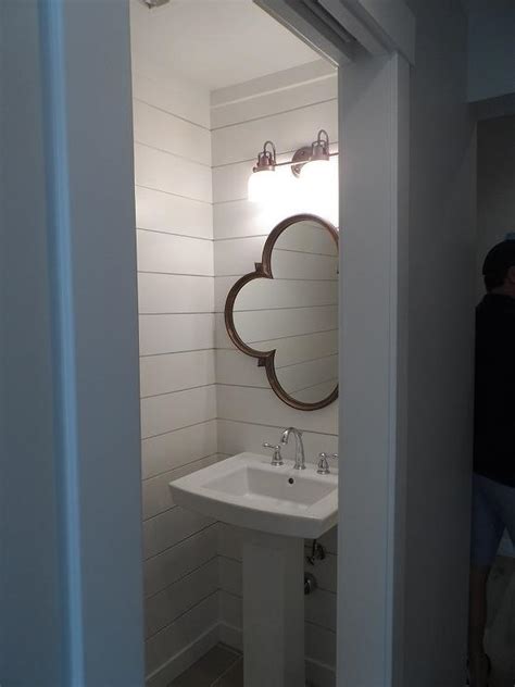 Wood Quatrefoil Mirror Over Pedestal Sink Transitional