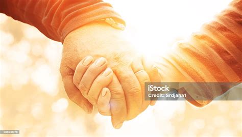 Seniors Holding Hands Stock Photo Download Image Now 2015 50 59