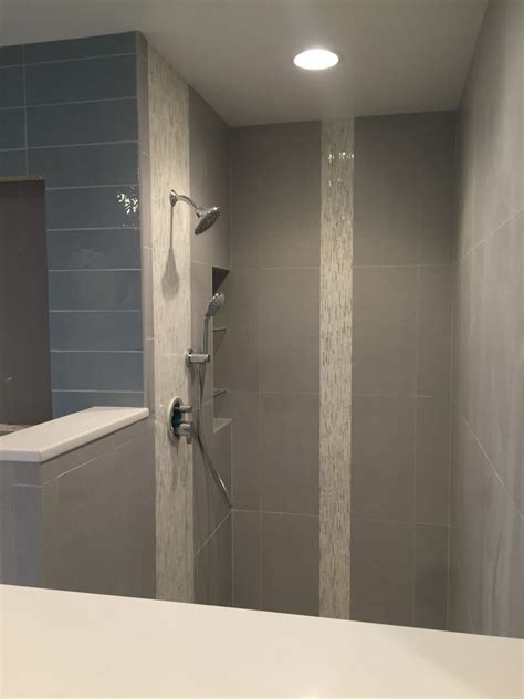 Calacatta (p) 3/4 slab, heavy rain calacatta (h), calacatta (p), sand (clear) 1 x 6 brick mosaic. Large 12×24 tile on shower wall with vertical AKDO heavy ...