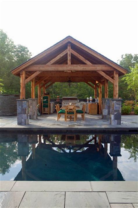 A Post And Beam Pavilion With Outdoor Kitchen