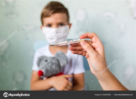 Girl Doctor Measures Body Temperature Small Boy Medical Mask Mercury