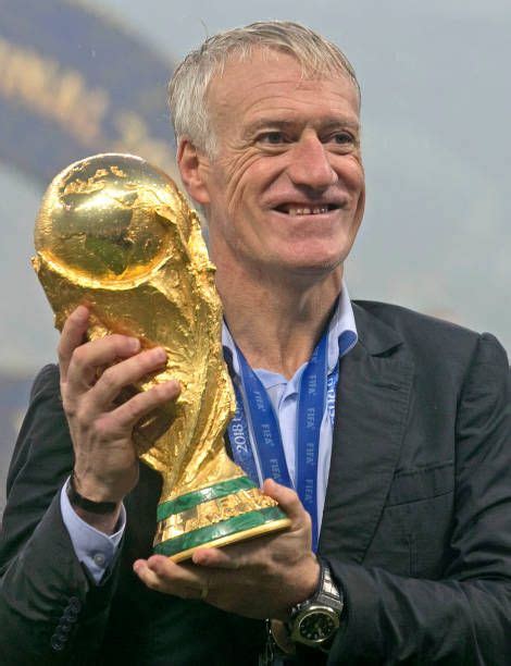 France Head Coach Didier Deschamps Poses With The Trophy After His Team