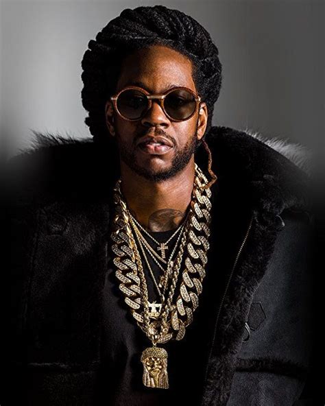 A Man Wearing Gold Chains And Sunglasses
