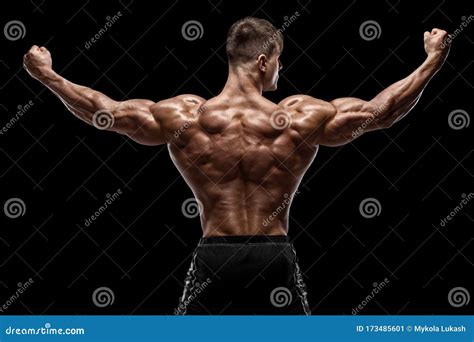 Muscular Man Showing Back Muscles Isolated On Black Background Strong