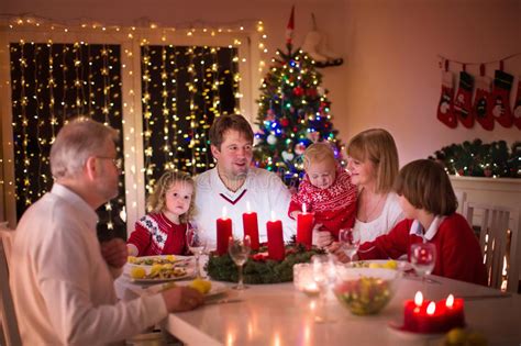 What do brits eat during christmas dinner? Family Enjoying Christmas Dinner At Home Stock Image - Image of fire, indoors: 59289309