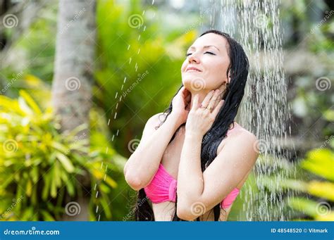 Woman With Long Hair In Bikini Under The Shower On Tropical Beach Stock