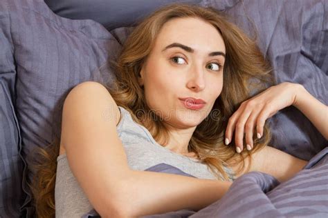 Close Up Happy Girl Waking Up On The Bed In The Morning Girl Woman Sleep Face Stock Image