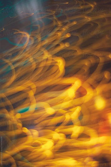 An Abstract Photograph Of Yellow And Blue Lights