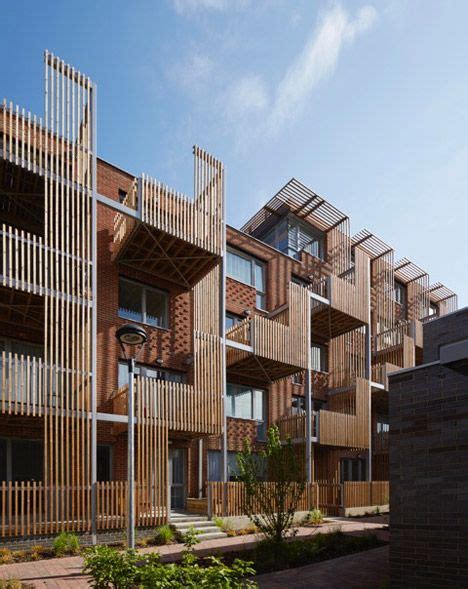 Vertical Timber Slats Provide Shade And Privacy For Staggered Balconies