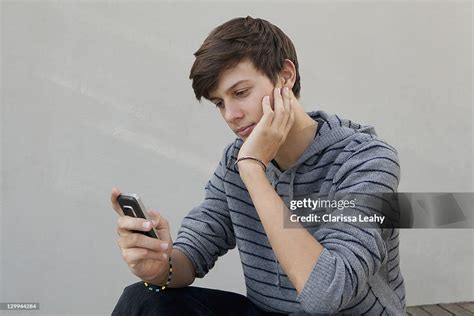 Teenage Boy Using Cell Phone High Res Stock Photo Getty Images