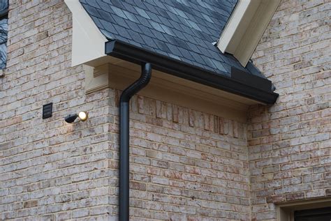 The colonial blue gutter is often a choice. 6" OG gutter & 4" round downspout | Dark bronze color ...