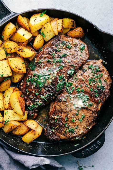 Once the steak tips are almost done, add them all back in along with the crushed garlic cloves, butter, and fresh rosemary, oregano, and thyme to the pan. Skillet Garlic Butter Herb Steak and Potatoes | The Recipe ...