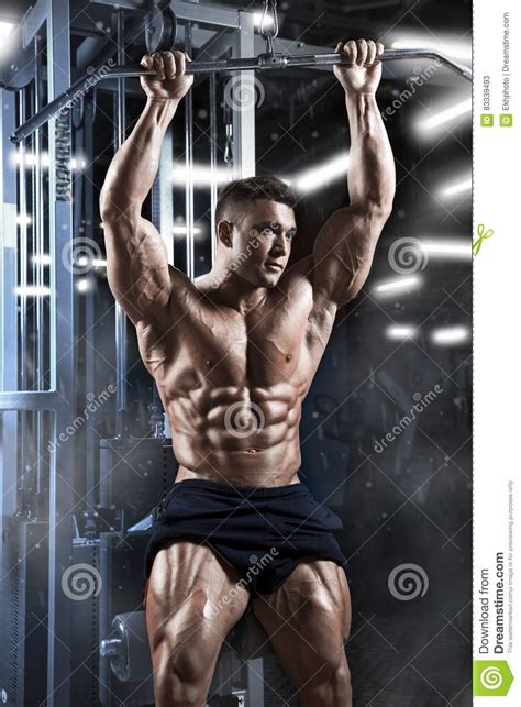 Athletic Muscular Guy Prepare To Do Exercises With Athletic Trainer In