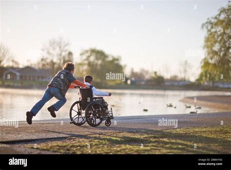 Children In Wheelchairs Playing Outside Hi Res Stock Photography And