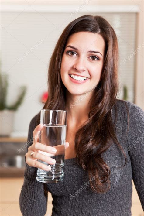 Woman Holding Glass Of Water Stock Photo By ©aremafoto 5653448