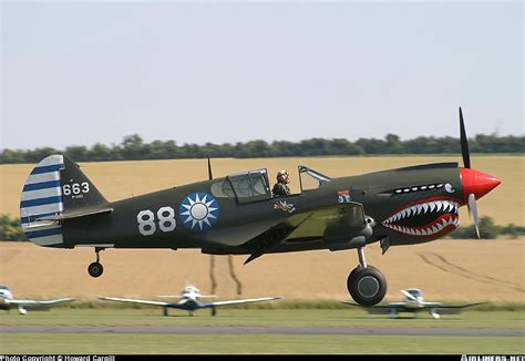 Asisbiz Airworthy Warbird Curtiss P 40N Warhawk NZ3009 Flying Tigers 88 10