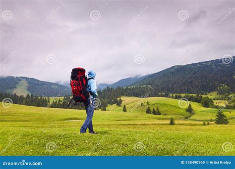 Hill Walker Walking In The Middle Of Mountain Wilderness Stock Image