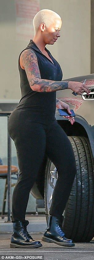 Amber Rose Is All Curves In A Skintight Black Jumpsuit After Instagram