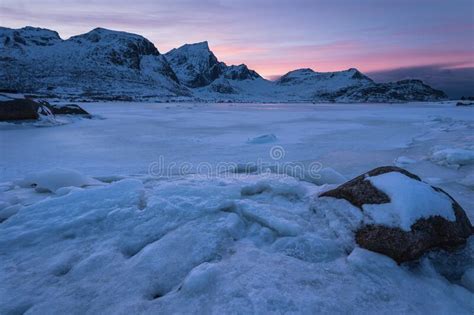 Beautiful Mountain And Frozen Lake At Sunset In Lofoten Island Norway