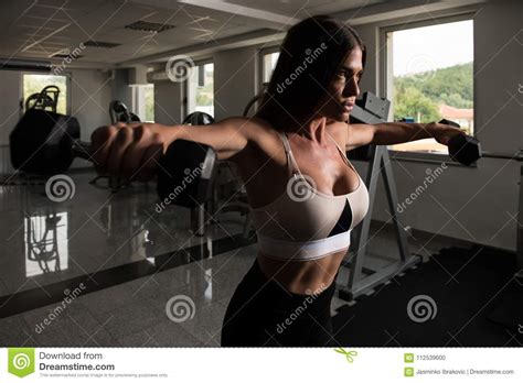 Woman Athlete Exercising Shoulder With Dumbbells Stock Photo Image Of