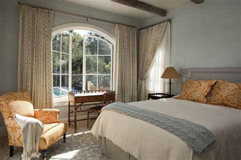 Searching for an arched window treatment. Dazzling swing arm curtain rod in Bedroom Mediterranean ...