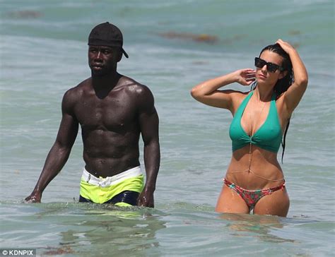 Manchester City Defender Bacary Sagna Relaxes On Miami Beach With Wife