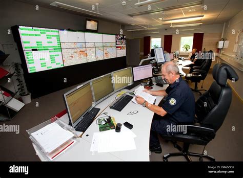 A Fire Station Rescue Commander In A Communication Room Of The