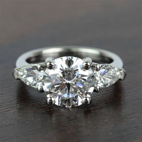 Use that as a starting point, but as mentioned before, going with a lower quality or slightly colored stone means you can afford a larger. 2.32 Carat Round & Pear Diamond Engagement Ring