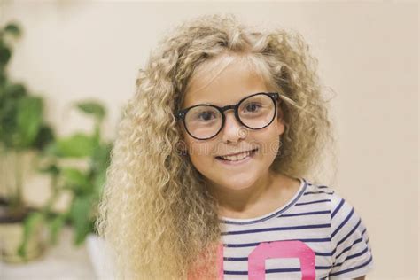Teenage Girl With Curly Hair And Glasses Laughs Stock Photo Image Of