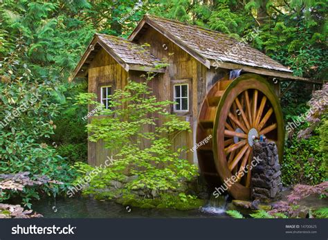 Rustic Wooden Water Mill With Wheel Turning Stock Photo 14700625