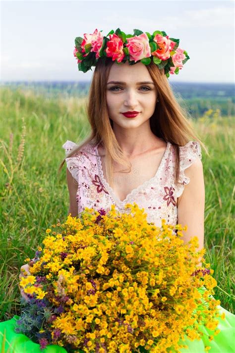 beautiful fashionable pretty gorgeous girl in dress on the flowers field nice girl with wreath