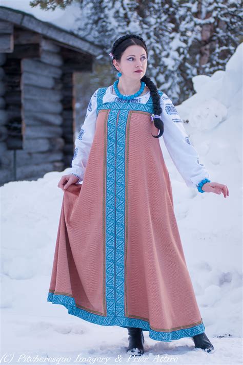 russian sarafan in wool silk with wool and metallic trim worn over an embroidered blouse