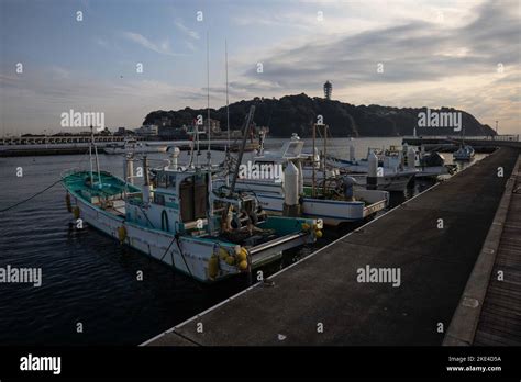 Fishing boats anchored inside Enoshima marina. Enoshima beach is a