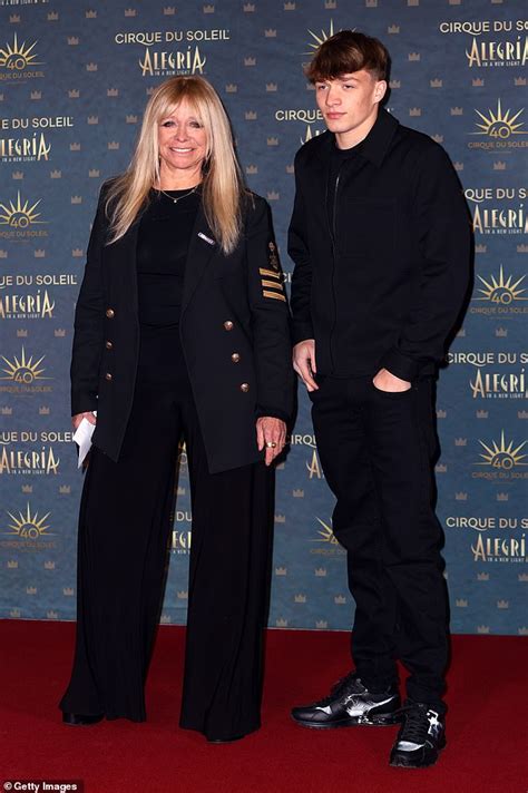 Jo Wood 68 Turns Heads In A Navy Military Jacket And Flared Trousers