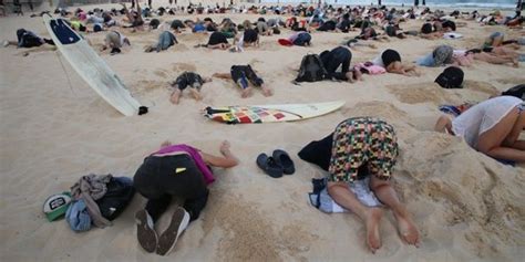 Australian Flash Mob Stick Heads In Sand To Protest Countrys Stand On