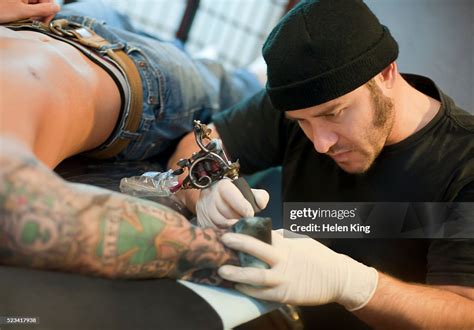 Tattoo Artist At Work High Res Stock Photo Getty Images