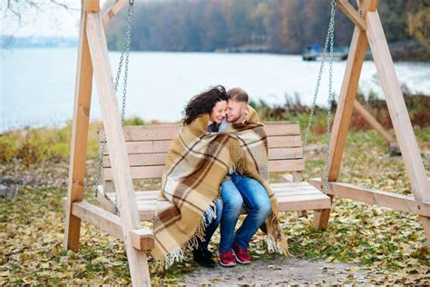 Amorous Couple On Romantic Date On Swings Outdoor Stock Image Image