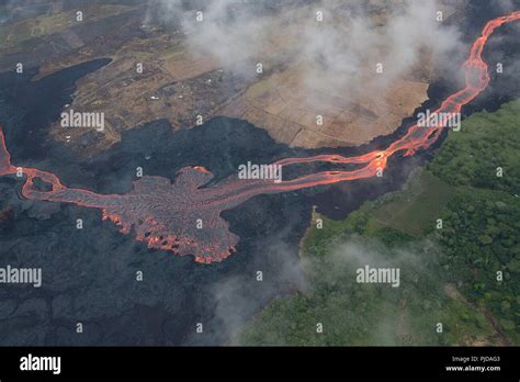 Aerial View Of River Of Lava Flowing Through Agricultural Lots In
