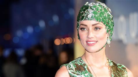 Amber Heard Wears Swim Cap To Aquaman Premiere Allure