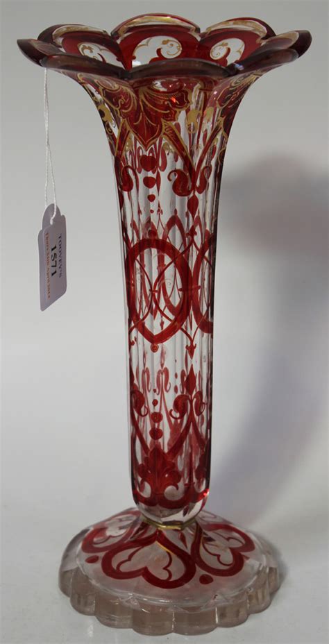 A Bohemian Clear And Ruby Overlay Glass Vase Late 19th Century Of Faceted Cylindrical Form With Fl