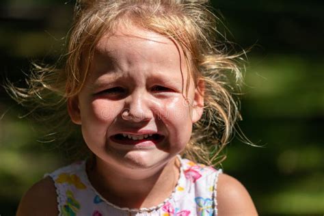The Child Is Crying And Laughing The Child Is Hysterical Stock Photo
