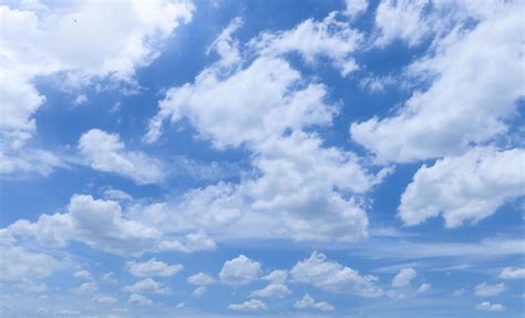 White Fluffy Clouds With Blue Sky On Sunny Day Beautiful Summer Cloudy
