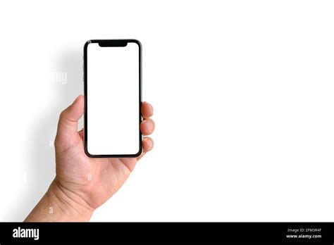 Man Holding Mobile Phone With Blank Screen On White Background Closeup