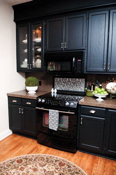 Modern kitchen with white cupboards and a green table under the lights. Pin by Chase Real Estate Group on For the Home | Black ...