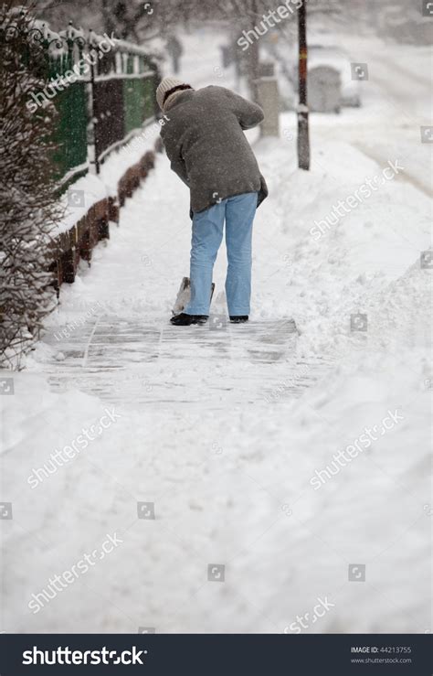 Woman Shoveling Snow Sidewalk Front Her Stock Photo 44213755 Shutterstock